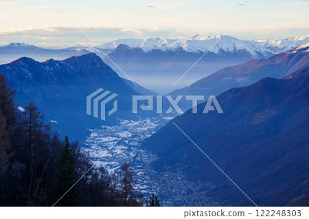 Snowy Village in Mountain Valley at Dusk Snowy Village in Mountain Valley at Dusk 122248303