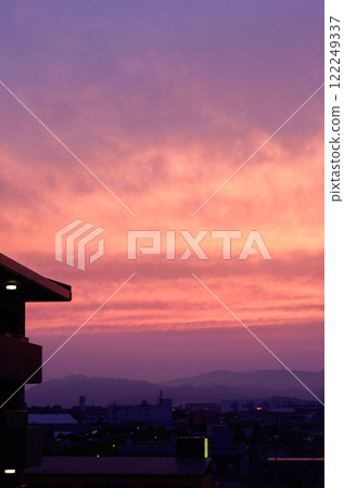 Clouds and sunset gradation, overlooking the city 122249337