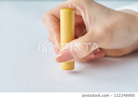 Hand stamping a seal Hand stamping a seal 122249980