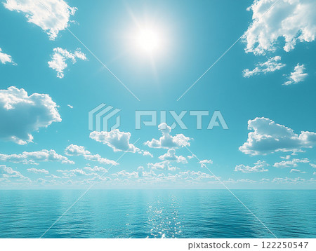 A calm sea surrounded by blue skies and bright sunshine 122250547