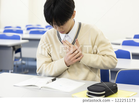 Student with sore hands Student with sore hands 122251173