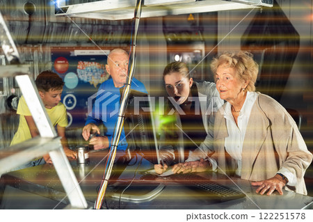 Grandmother, grandfather and kids in escape room Grandmother, grandfather and kids in escape room 122251578