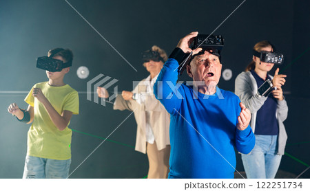 Elderly parents use virtual reality glasses with children Elderly parents use virtual reality glasses with children 122251734