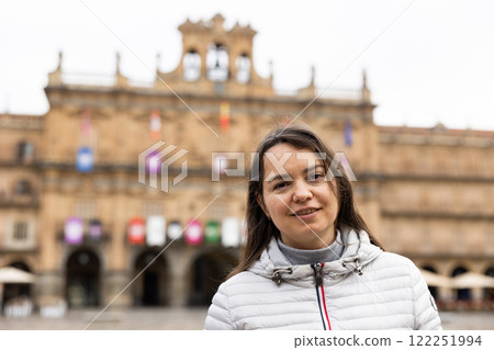 Portrait of a female tourist standing on Plaza Mayor square in Salamanca Portrait of a female tourist standing on Plaza Mayor square in Salamanca 122251994