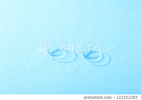 Transparent contact lenses for eyes on a blue background 122252265