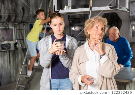 Teenager granddaughter, together with her grandmother, unravel another secret in quest room Teenager granddaughter, together with her grandmother, unravel another secret in quest room 122252429