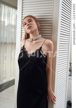 Stylish woman in elegant dress standing and collar 122253093