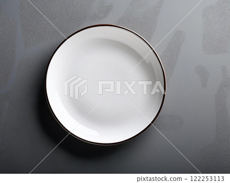 White plate on a black background 122253113