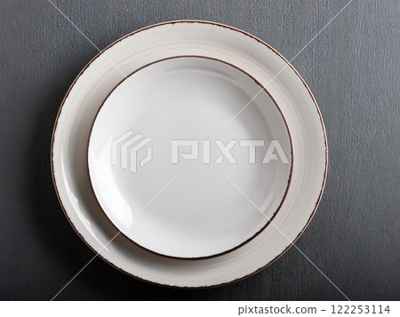White plate on the table 122253114