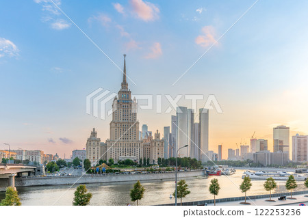 High-rise stalinist building near river at summer sunset in Moscow, Russia. Historic name is Hotel Ukraine. High-rise stalinist building near river at summer sunset in Moscow, Russia. Historic name is Hotel Ukraine. 122253236