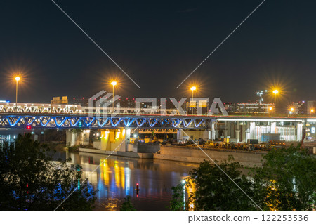 The scyscrapers of the Moscow City at night and the Dorogomilovsky bridge with illumination. Translation of text - street names: Krasnopresnenskaya, center, etc. 122253536