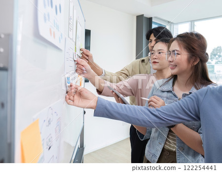 Brainstorming session for the creative team of designers in application design and implementation planning ux ui Teamwork of modern business teams 122254441