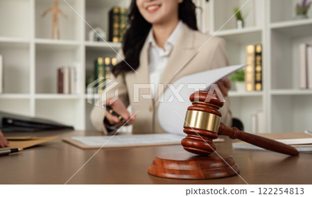 Lawyer and businesswomen discussing and introducing Providing legal advice regarding signing insurance contracts or financial contracts Lawyer and businesswomen discussing and introducing Providing legal advice regarding signing insurance contracts or financial contracts 122254813