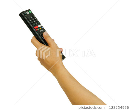 Asian woman use finger of left hand to press button on television remote control isolated on white background with clipping path. Asian woman use finger of left hand to press button on television remote control isolated on white background with clipping path. 122254956