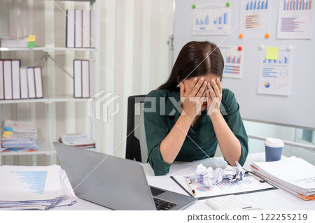 Young businesswoman is having problems with her work at work. Feeling stressed and unhappy because the results did not meet the goals 122255219