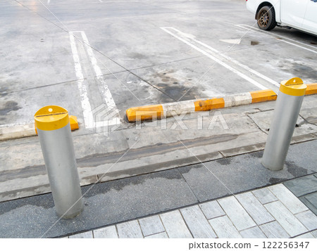 Barrier installation for safety in urban parking lots ground level open space solutions Barrier installation for safety in urban parking lots ground level open space solutions 122256347