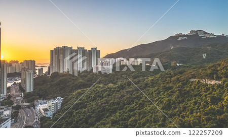Skyline Overlooking Mountains and Ocean at Sunset, HK Jan 12 2021 Skyline Overlooking Mountains and Ocean at Sunset, HK Jan 12 2021 122257209