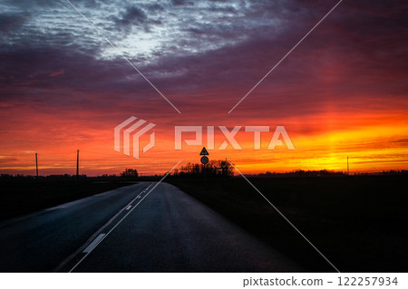 Very beautiful colorful sunset, highway and car. Sunset trip. Very beautiful colorful sunset, highway and car. Sunset trip. 122257934
