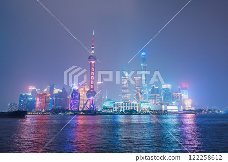 Cityscape view of Shanghai city at night. Skyscraper of Lujiazui in Pudong, view from The Bund of Shanghai, China. landmark and popular for tourism attractions. Travel and Vacation concept 122258612