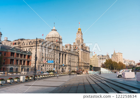 Cityscape view of Shanghai city in the morning. Skyscraper of The Bund, historical district in central Shanghai, China. landmark and popular for tourism attractions. Travel and Vacation concept Cityscape view of Shanghai city in the morning. Skyscraper of The Bund, historical district in central Shanghai, China. landmark and popular for tourism attractions. Travel and Vacation concept 122258634