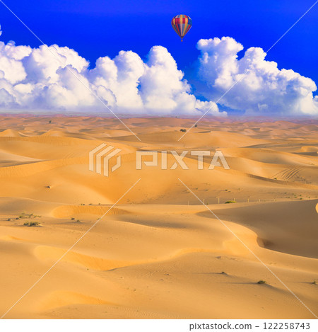 Dubai's desert area and midsummer cumulonimbus clouds Dubai's desert area and midsummer cumulonimbus clouds 122258743