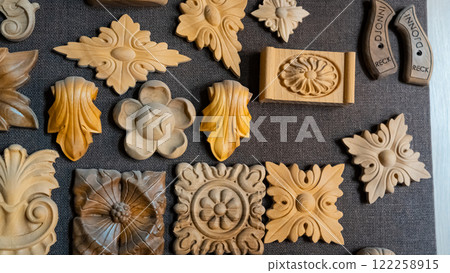 carving element. furniture in classic style. white color wood with gold trim. patina. carving. small depth of field. luxury furniture. use as background. 122258915
