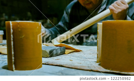 carpenter using nail gun or brad nailer tool on wood box in a workshop ,furniture restoration woodworking concept. selective focus carpenter using nail gun or brad nailer tool on wood box in a workshop ,furniture restoration woodworking concept. selective focus 122258982