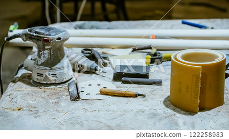 Various tools: file, screwdriver, hammer, pliers, garden tools are displayed on wooden shelf inside rustic garage or manufactory, workshop studio in a rustic garden house. Hobby, leasure activity Various tools: file, screwdriver, hammer, pliers, garden tools are displayed on wooden shelf inside rustic garage or manufactory, workshop studio in a rustic garden house. Hobby, leasure activity 122258983