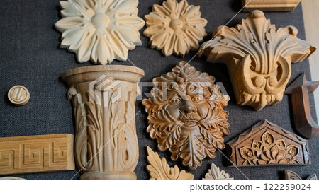 carving element. furniture in classic style. white color wood with gold trim. patina. carving. small depth of field. luxury furniture. use as background. 122259024