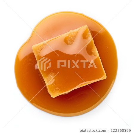 caramel candy in melted caramel sauce caramel candy in melted caramel sauce 122260599