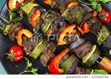 Metal skewers with delicious roe meat. 122260780