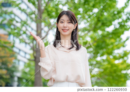 A Japanese woman giving a tour 122260930