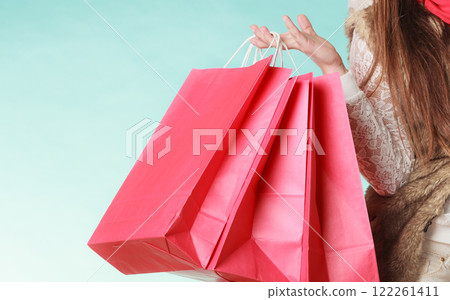 Closeup of customer bags shopping. Winter fashion. 122261411