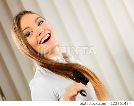 beautiful woman with long hair and brush beautiful woman with long hair and brush 122261424
