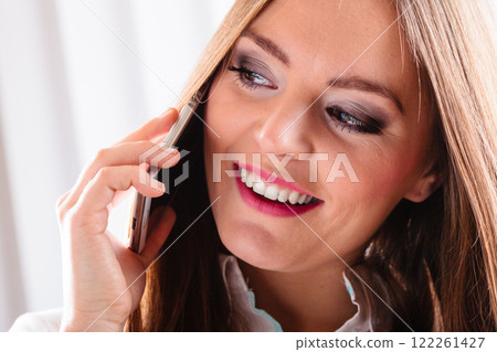 Smiling young woman use phone. Smiling young woman use phone. 122261427
