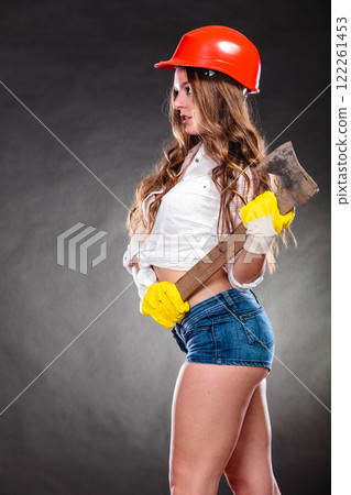 Sexy strong woman feminist with axe working. Sexy strong woman feminist with axe working. 122261453