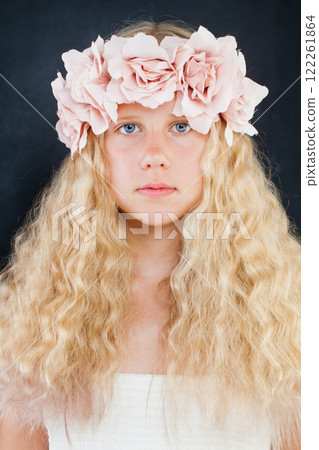 Fashion beauty studio portrait of young girl in flower decor on long healthy blonde hair Fashion beauty studio portrait of young girl in flower decor on long healthy blonde hair 122261864