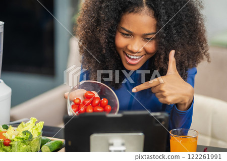 Lifestyle woman enjoys healthy fruit breakfast after yoga training. fitness, nutrition, home lifestyle. 122261991