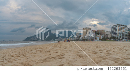 Ipanema Beach in Rio de Janeiro with mountains and favelas in the background. 122263361