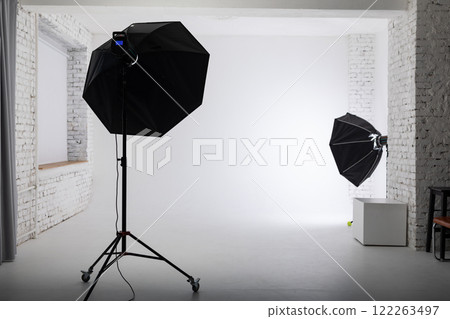 Clear white cyclorama. Light background with with professional lighting equipment. Plain wall empty photo studio 122263497