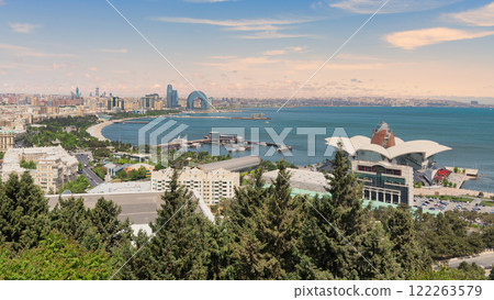 Aerial view of Deniz Mall and Crescent Development Project with waterfront in background in Baku, Azerbaijan 122263579