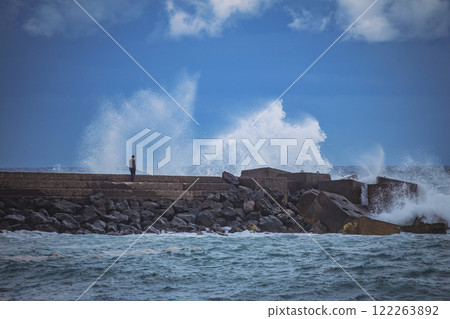 Man looking at storm at sea. 122263892
