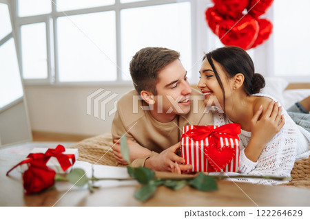 Exchange of gifts. Romantic day together. Valentines day, couple, relationships and people concept. 122264629
