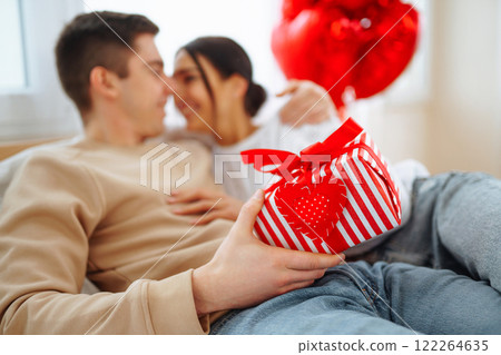 Exchange of gifts. Romantic day together. Valentines day, couple, relationships and people concept. 122264635