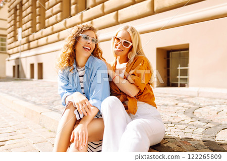 Laughing woman enjoying weekend together. Summer playful mood concept. Laughing woman enjoying weekend together. Summer playful mood concept. 122265809
