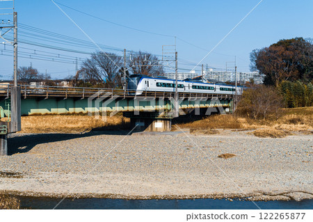 Tokyo Chuo Line Azusa Express train running on Asakawa railway bridge Tokyo Chuo Line Azusa Express train running on Asakawa railway bridge 122265877