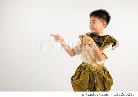 Portrait Thailand kid boy smiling traditional Thai dress costume indicate finger empty space, studio isolated white background, primary child pointing index out with copy space Portrait Thailand kid boy smiling traditional Thai dress costume indicate finger empty space, studio isolated white background, primary child pointing index out with copy space 122266283