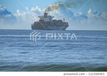 Cargo ship with containers of goods at sea. International trade sea route. 122266463