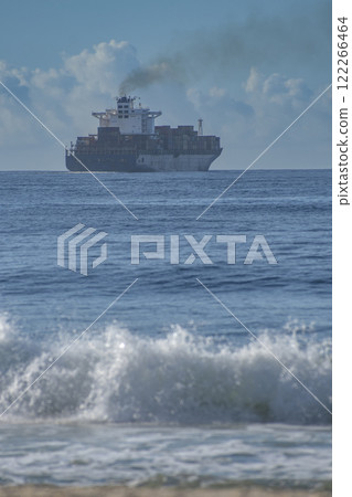 Cargo ship with containers of goods at sea. International trade sea route Cargo ship with containers of goods at sea. International trade sea route 122266464