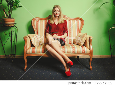 Pretty young woman on vintage sofa. Fashion. Pretty young woman on vintage sofa. Fashion. 122267000